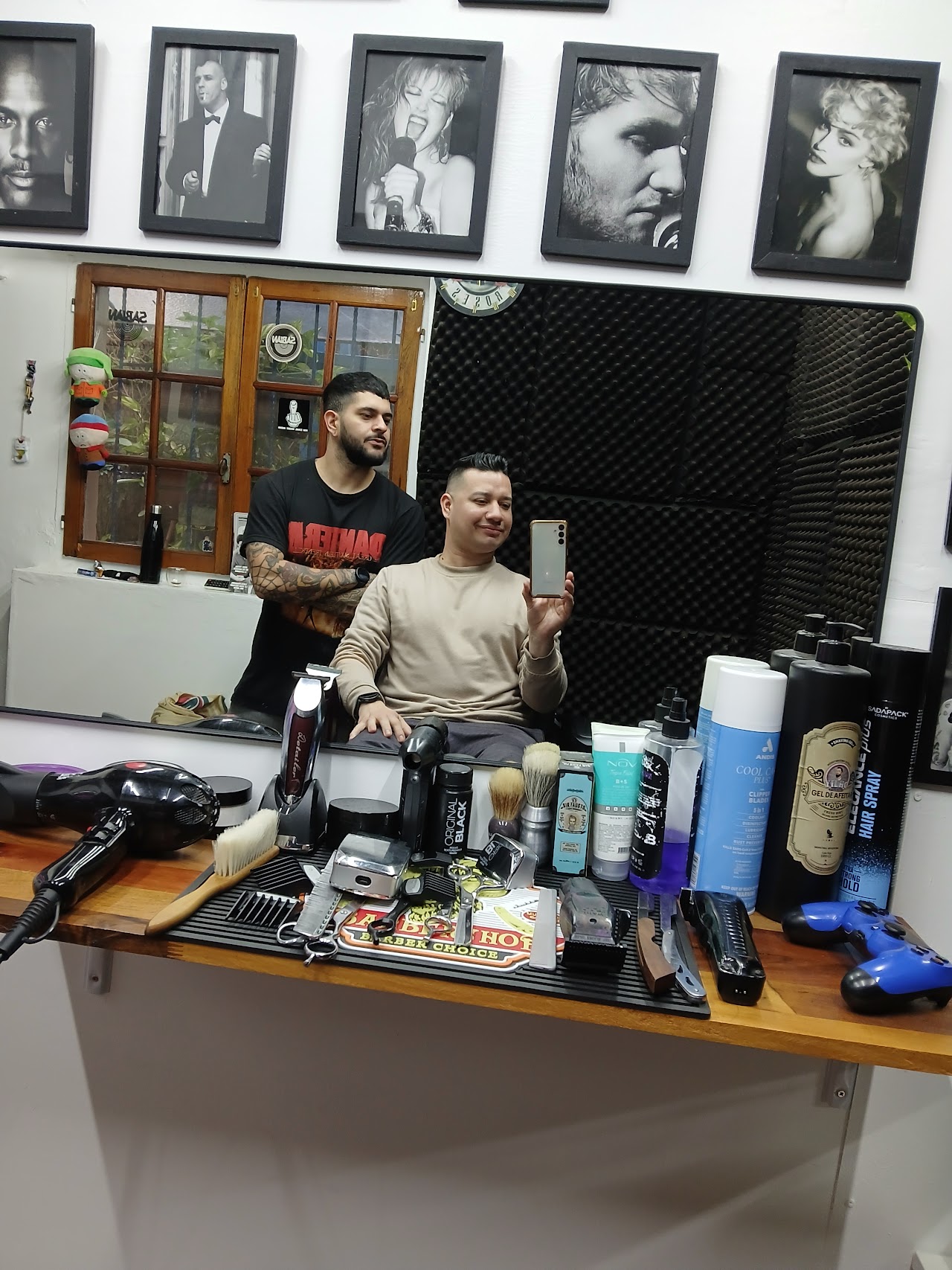 Luxurious barbershop interior with a heavy rock-and-roll influence, featuring vintage Marshall amplifiers, electric guitars on the wall, and high-end leather barber chairs. The lighting is warm and cinematic, reflecting off dark wood cabinetry and marble surfaces. The atmosphere is private, moody, and extremely premium, perfectly capturing the aesthetic of an elite studio in Villa Crespo.